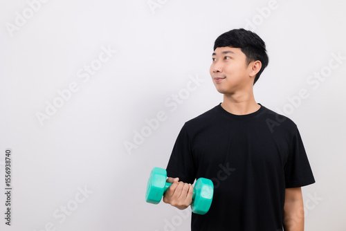 Positive asian man happy smile black shirt work out with dumbbell smile and look at space isolated