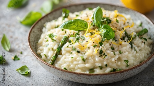Creamy Risotto with Asparagus and Fresh Basil Garnished with Lemon