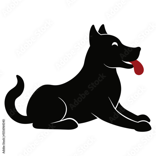 Happy black dog with tongue sticking out lying down in silhouette