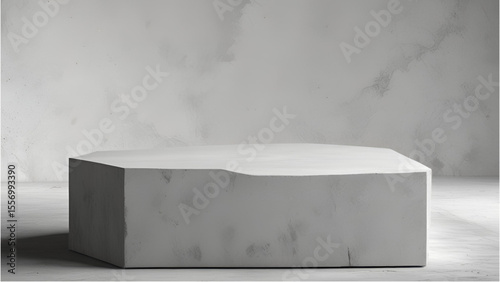 Concrete block podium stands in an empty studio space for display