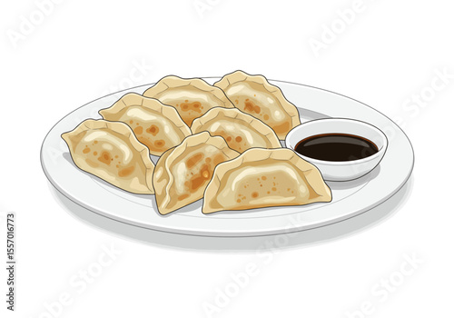 Plate with dumplings and a bowl of soy sauce