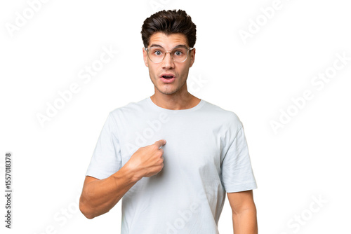 Young caucasian handsome man over isolated background pointing to oneself