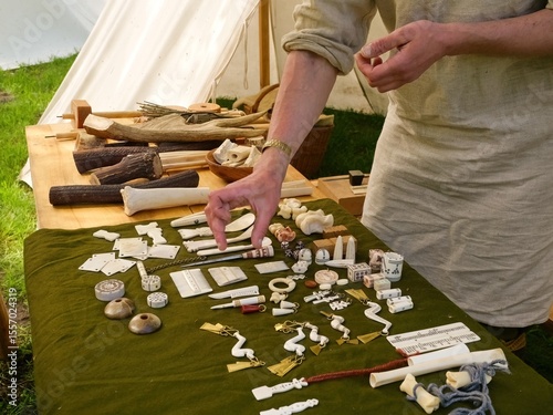 Viking or Medieval Craft Exhibit with Bone Artifacts. Medieval Bone Craft Display at Historical Fair