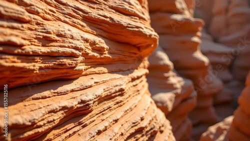 Dramatic close-up of sandstone layers. Natural textures, geological formation, warm lighting. Erosion, rock, landscape.