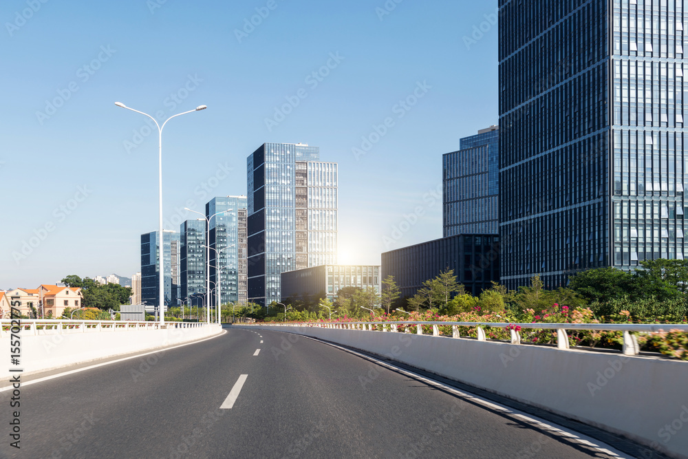 Fototapeta premium Highway overpass near office buildings