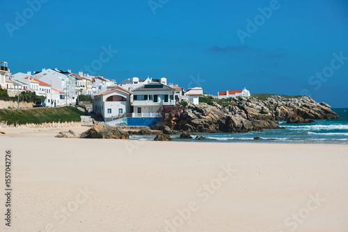 Coastal Village with White Houses by the Beach and Rocky Shoreline. Peniche Portugal