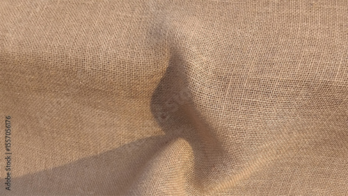 Jute fabric close-up. Natural textured sacking burlap background. Hessian sack canvas woven texture