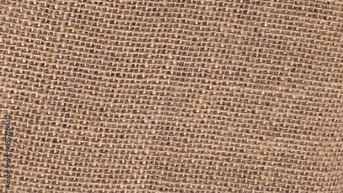 Close-up of fabric woven from burlap photo. Natural textured sacking burlap background. Hessian sack canvas woven texture