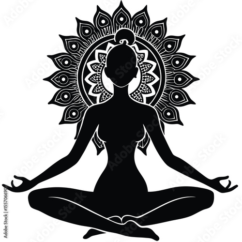 Silhouette of a woman meditating in lotus pose with a decorative floral mandala