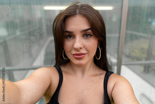 Free Download young beautiful happy woman taking selfie with smartphone in city street in perfect youth culture style - GFXLoad