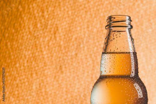 bottle of chilled orange soda closeup