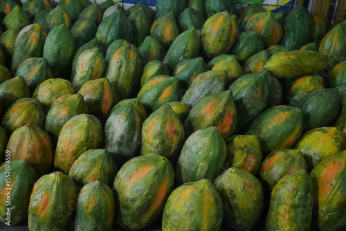 Papaya fruit (Carica papaya) neatly arranged in a fruit stall. The fruit, which is thought to originate from Mexico, South America, is now growing well and spreading to other tropical countries.
