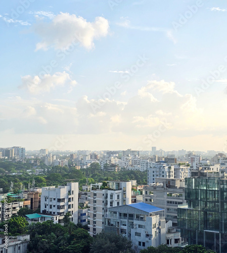 Dhaka city skyline with modern buildings and clear blue sky, urban architecture and cityscape view of Bangladesh capital. High angle view of Dhaka city residential and financial buildings at sunny day