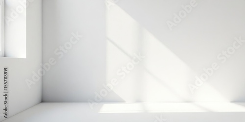 Empty Room Corner with Sunlight Streaming Through a Window Illuminating the White Walls and Floor