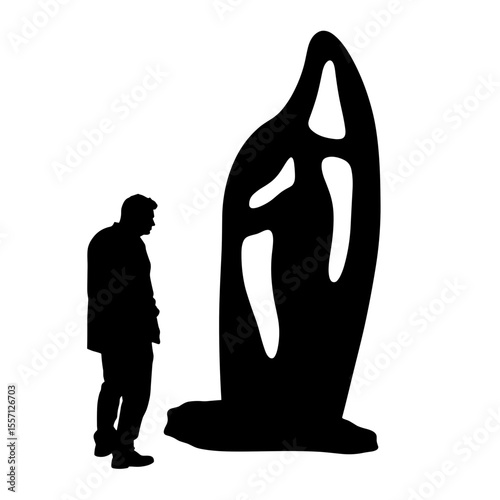 Silhouette of person admiring large abstract stone sculpture. Person stands observing unique modern art piece. Intricate design details showcase artistic skill.