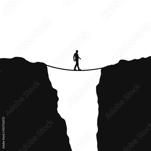 Silhouette of man walking tightrope between two cliffs. Man balancing on rope bridge spanning deep chasm. Dramatic silhouette image ideal for concepts related to risk, challenge