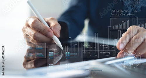 Finance analyst working on business analytics and data management system to make financial report with business performance, KPI dashboard. Corporate strategy for finance, digital marketing plan