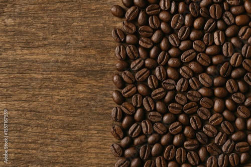 Vintage-style coffee beans with wooden background