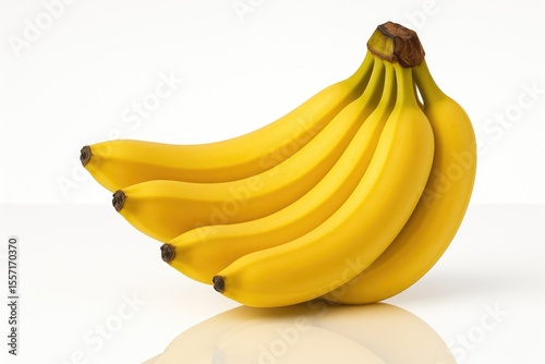 Fresh yellow bananas with mirror-like reflection on a plain white backdrop