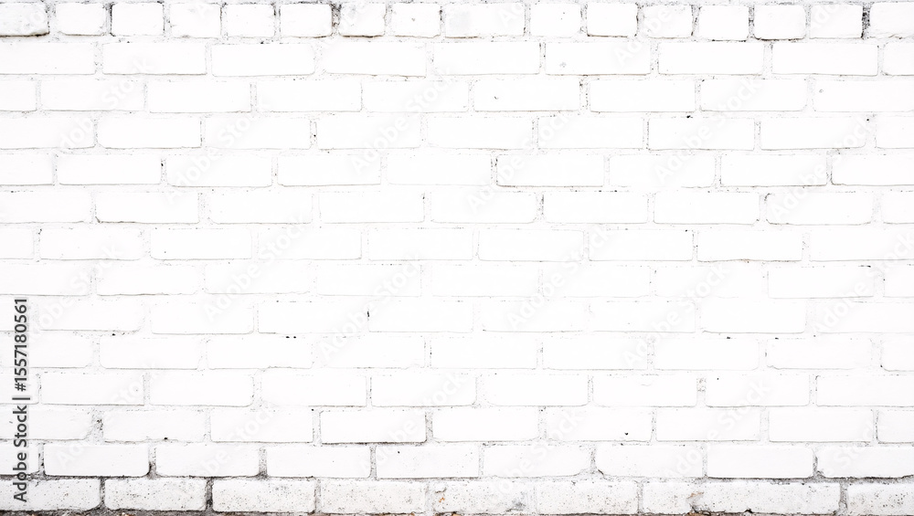 Obraz premium A white-painted brick wall with visible mortar lines, creating a clean and minimalist texture.