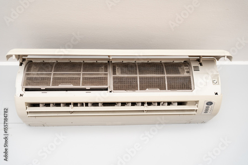 Dirty in dust and mold air conditioner filter close-up. Home air conditioner maintenance