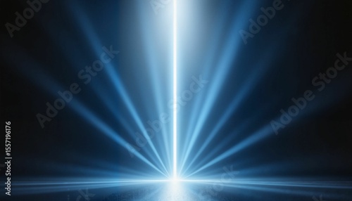 Abstract blue light rays creating a spotlight effect on dark background  