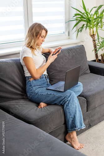 Free Download Remote worker using phone and laptop at home - GFXLoad