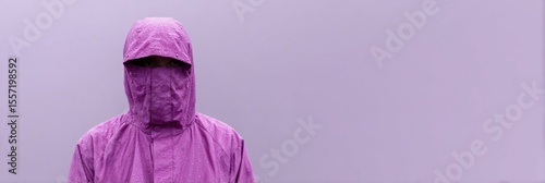 Purple-clad figure shrouded in mystery, embodying surrealist minimalism, evokes International Cloak Day whimsy amidst pastel anonymity