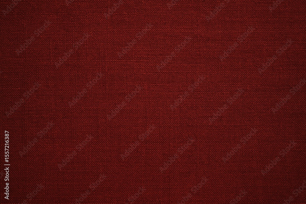 Fototapeta premium Deep crimson cotton surface with a matching red backdrop