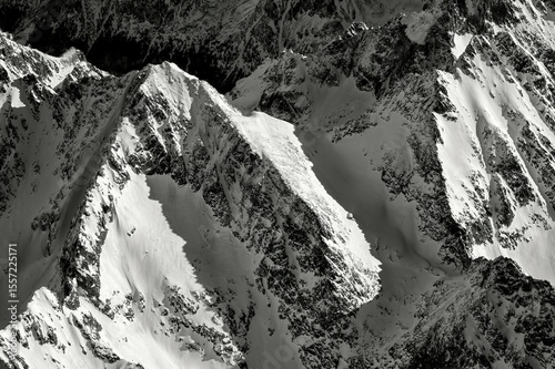 Fototapeta Naklejka Na Ścianę i Meble -  The highest peak in Rysy in Poland in winter when viewed from above, aerial view. The snow-capped peaks of the High Tatras mountains, Poland, Polskie gory.