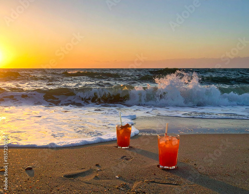 Dusk on the beach, waves breaking, drinks on the sand