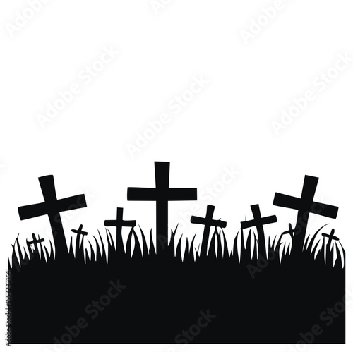 Silhouettes of crosses in grassy cemetery