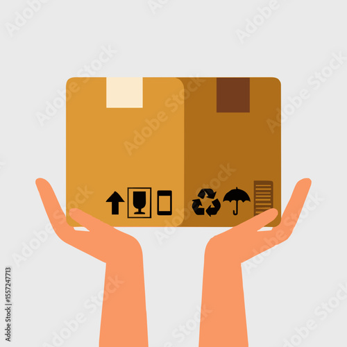 hand holding a cardboard box