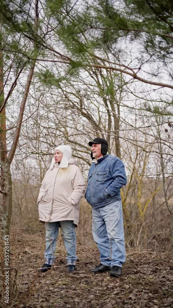 elderly couple enjoys a peaceful walk in the forest, holding hands and smiling. Authentic, unposed moment of love and connection in nature. Perfect for lifestyle, wellness, and aging-related content elderly couple enjoys a peaceful walk in the forest, holding hands and smiling. Authentic, unposed moment of love and connection in nature. Perfect for lifestyle, wellness, and aging-related content