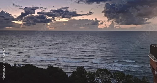 Light beam from lighthouse by Baltic Sea after sunsed