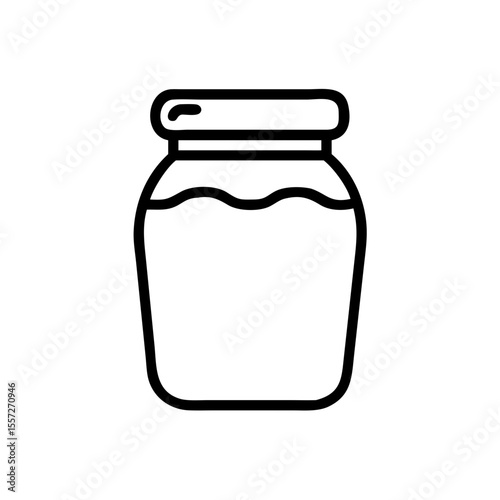 Glass jar with lid for homemade preserves.  Clear glass jar ideal for storing jams jellies or other pantry staples. Stylish glass jar perfect for kitchen organization and food photography.