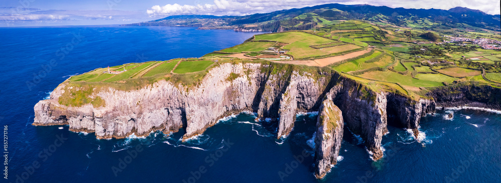 Naklejka premium Azores , Portugal. amazing Sao Miguel island. aerial drone panorama of miradouro do Cintrao with impressive rugged rocks and ocean in norther part