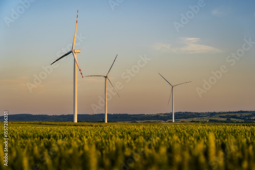 The Future Turns With the Wind – Clean Energy Infrastructure Driving Sustainable Growth, Responsible Industry, and Climate Action. Rural Poland during sunset