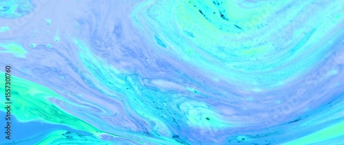 Abstract marine background. A blue wave of blurring paint. The sea, sea foam in motion.