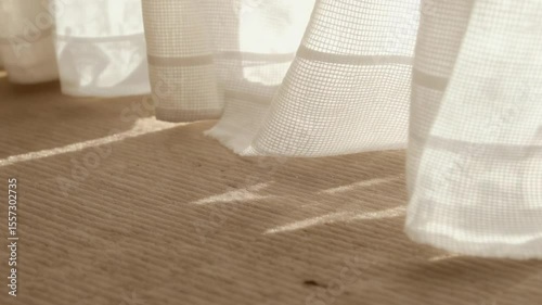 Curtain Blowing Gently in the Breeze with Sunlight Streaming Through