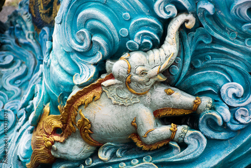 Carved sculpture art animal of himmapan and creatures mythical legend for thai people travelers travel visit respect praying holy mystery in Wat Phra Kaew temple at Chainat city in Chai Nat, Thailand