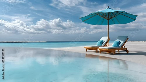 Sunny tropical beach scene featuring two lounge chairs under a blue umbrella beside a tranquil infinity pool perfect for relaxation, summer, and vacation serene ambience coastal luxury