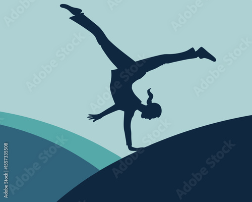 Acrobat performing handstand on a graded surface silhouette with transparency