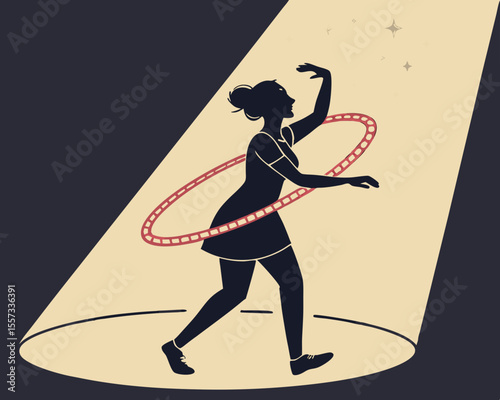 Silhouette of a woman performing with a hula hoop under a spotlight