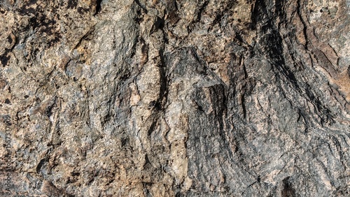 Rough surface of natural stone showing intricate patterns and textures