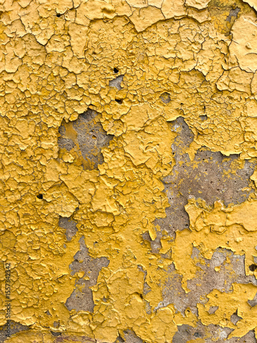 Yellow grunge texture of peeling paint