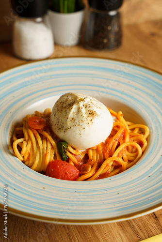 Spaghetti with tomato sauce and burrata cheese