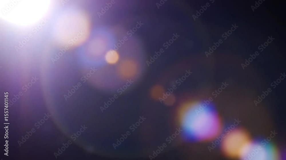 Soft pastel lens flare ring with light scattering and dark negative space