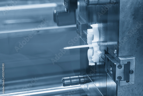 Close up scene the plastic parts from injection machine in the light blue scene.