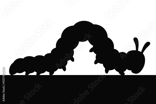 Black caterpillar silhouette on white background with black ground line